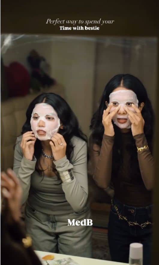 Two women wear facial masks; one applies makeup, highlighting the beauty benefits of MedB's authentic Korean skincare products.